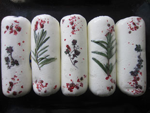Herb logs with thyme, rosemary and pink peppercorns made with goat milk from Sunset Acres Farm